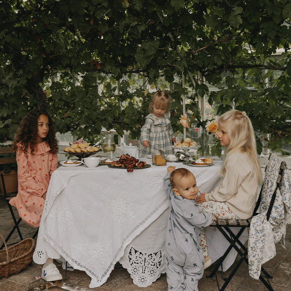Kids enjoying an afternoon tea in the garden